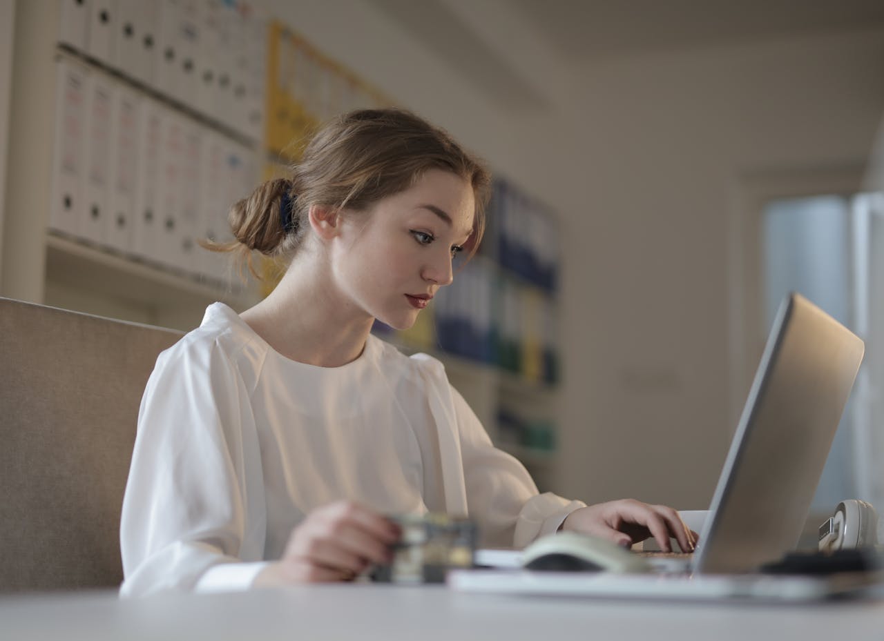 Focused Woman looking at Laptop